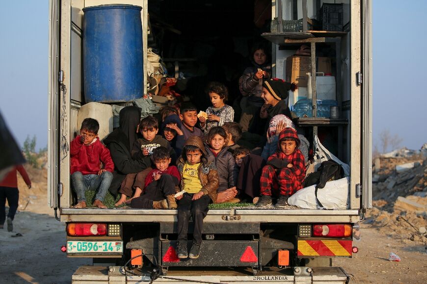 Displaced Palestinians make their way to northern Gaza after access was reopened