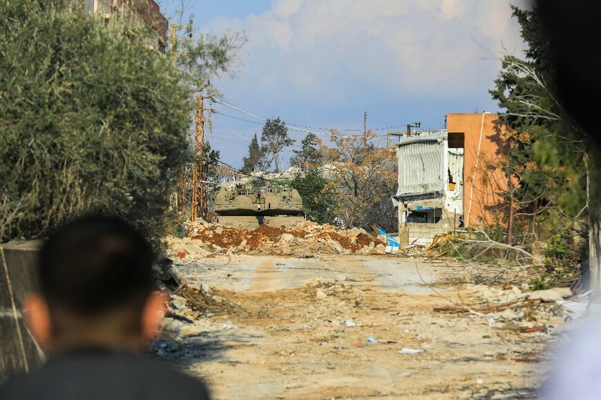 An Israeli army tank blocks the entrance to the southern Lebanese village of Hula 