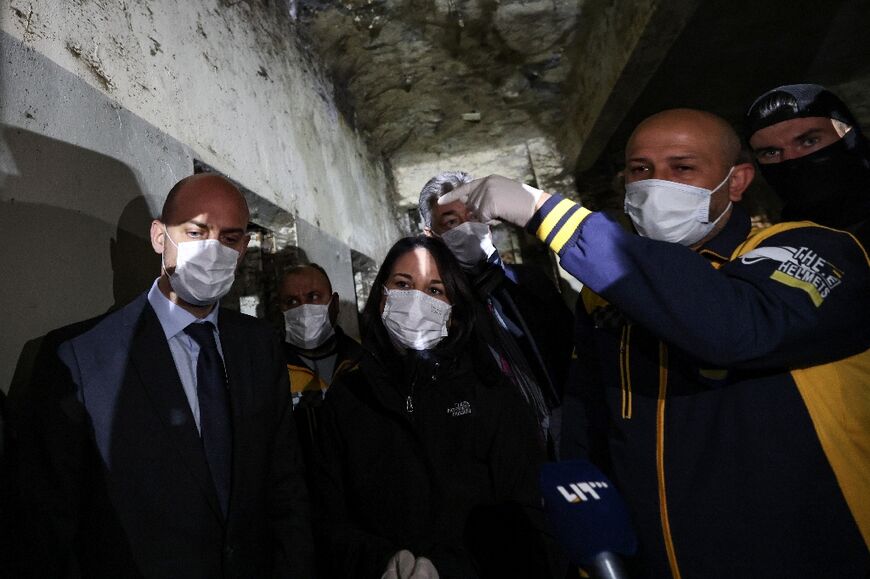 France's Foreign Minister Jean-Noel Barrot (L) and his German counterpart Annalena Baerbock visit Saydnaya prison  accompanied by rescuers from Syria's White Helmets