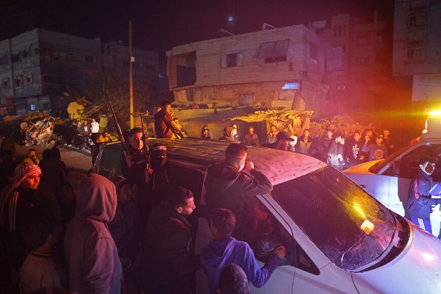 Fighters drive through Khan Yunis as Gazans celebrate news of a ceasefire deal