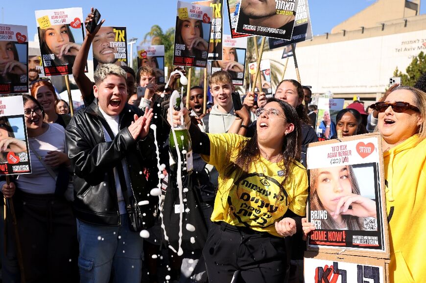 Israelis in Tel Aviv celebrate the release of Agam Berger, 20, an Israeli woman soldier held for more than 15 months in Gaza