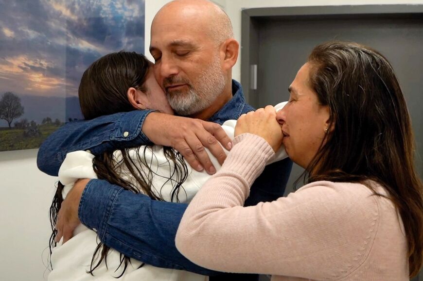 This handout picture released by the Israeli army shows former hostage Naama Levy reunited with family