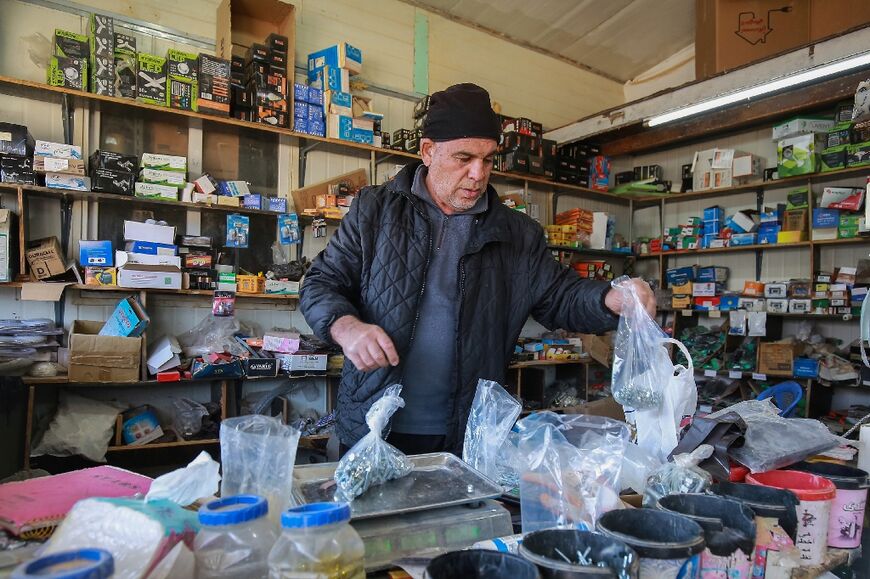 'I can't go back,' says Syrian refugee Yousef Hariri, who owns a shop in the camp