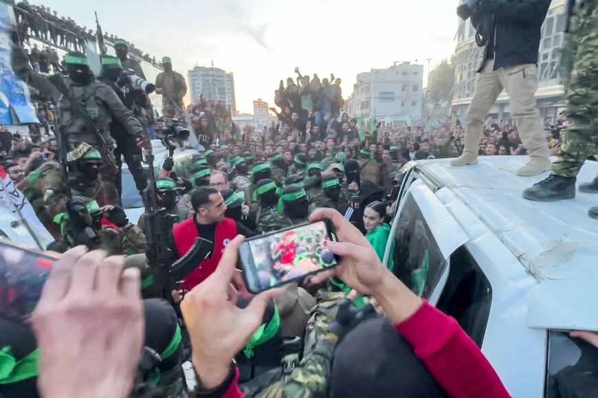 A screen grab from AFPTV shows one of the Israeli hostages exiting a vehicle before being handed over to the International Committee of the Red Cross