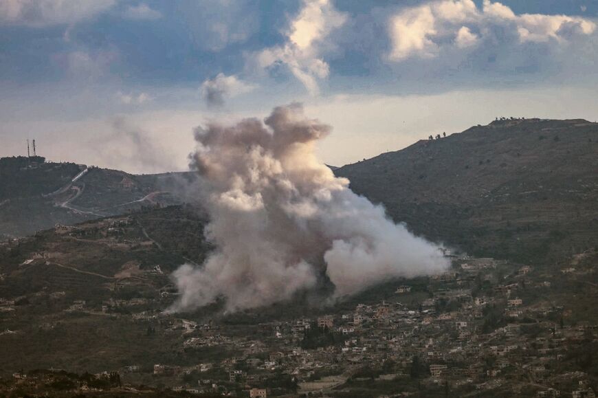 Smoke rises from the site of controlled explosions during demolition activities by the Israeli army in the southern Lebanese village of Kfar Kila