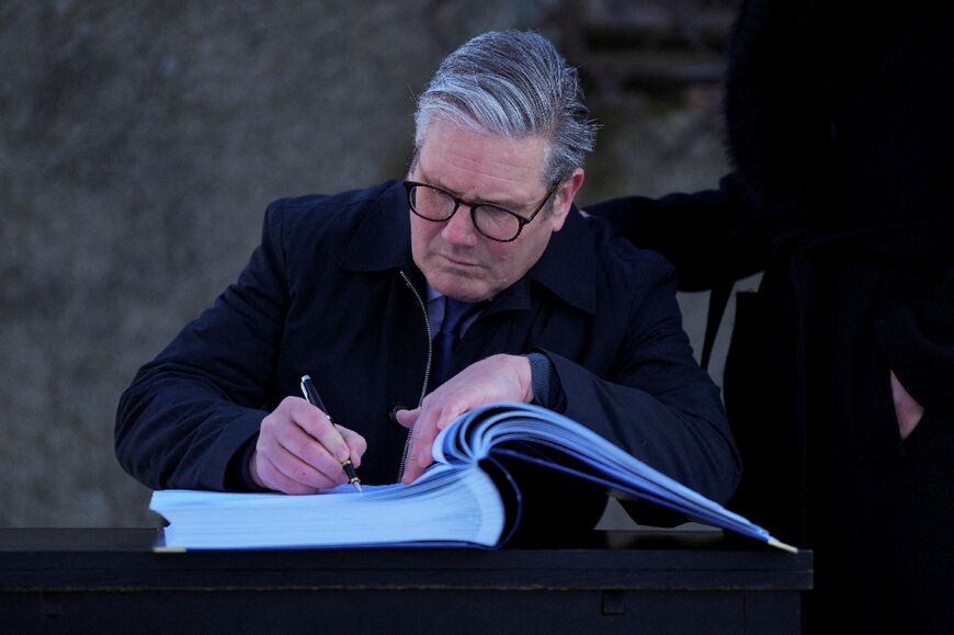 Starmer signed a book in front of a gas chamber during his visit