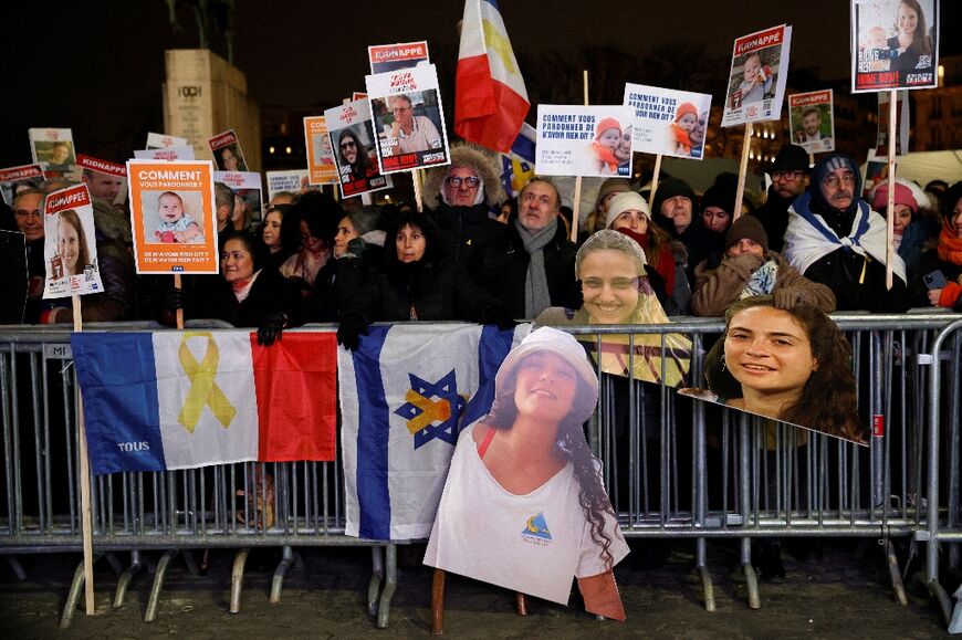 Participants at the rally held up "bring them home" placards with the faces of some of the hostages