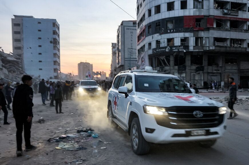 Vehicles of the International Committee of the Red Cross move through western Gaza City