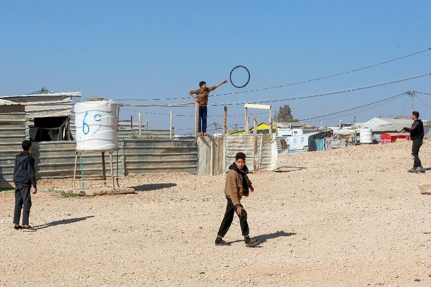 Youths playing outdoors at the camp, which sits near the Jordanian city of Mafraq