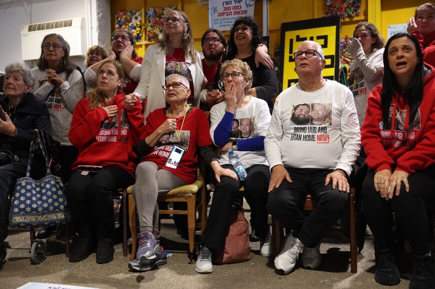 Friends of Israeli hostage Yair Horn watch his release from captivity on Saturday