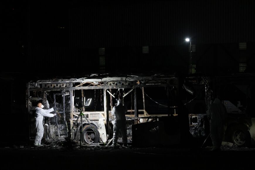 Security forces and bomb disposal units are deployed to the scene of a bus explosion in Bat Yam 