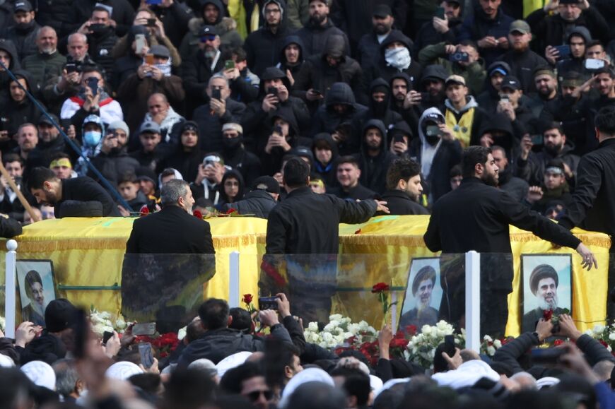 The coffins of Nasrallah and Safieddine are paraded during their funeral ceremony at the Camille Chamoun Sports City Stadium