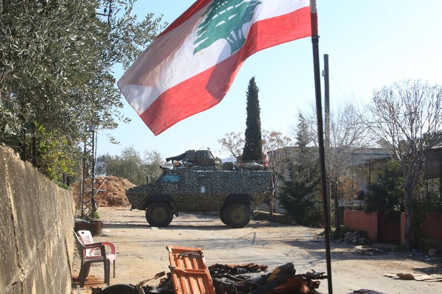 Lebanese army soldiers guard the entrance of the southern Lebanese village of Houla on February 17, 2025