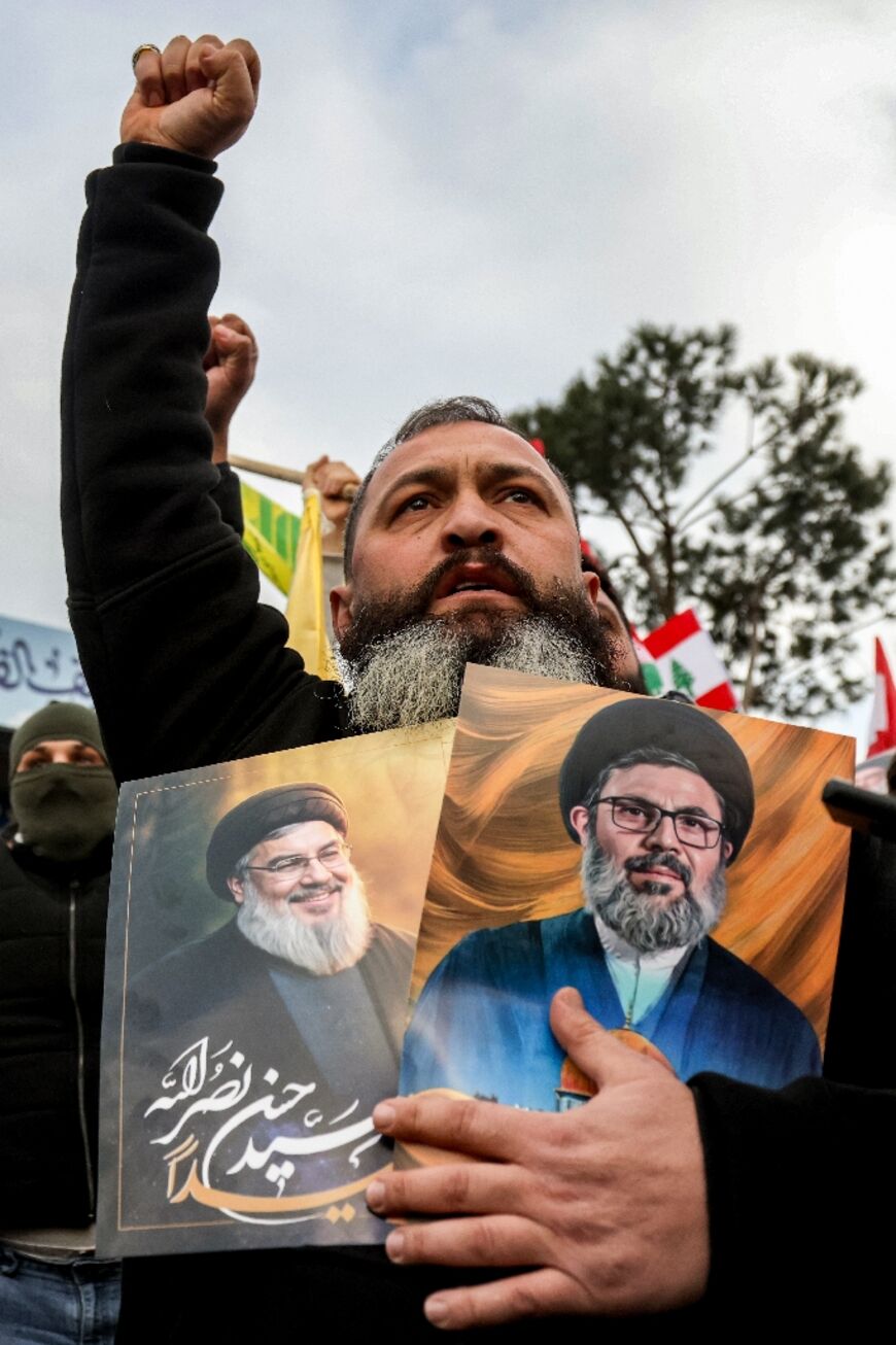 Protestors gathered to block the road to Beirut's airport after the Lebanese government decided to halt flight from Iran