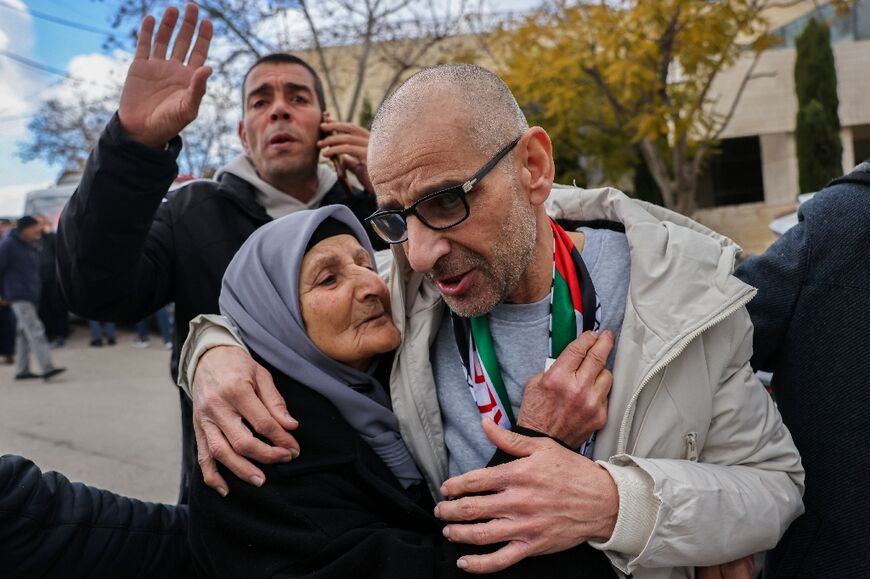 A former prisoner is greeted by his mother on arrival in Ramallah