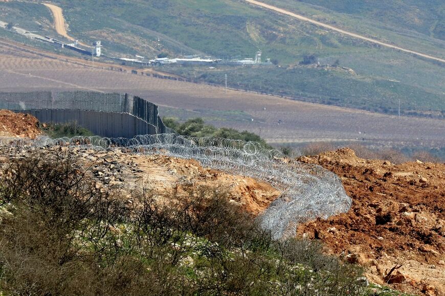 Barbed wire installed by Israeli soldiers around an outpost near the Odaisseh-Kfar Kila road inside Lebanon from which they did not withdraw