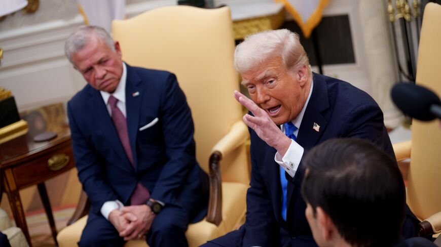 US President Donald Trump speaks during a meeting with Jordan's King Abdullah II bin Al-Hussein (L) in the Oval Office of the White House, on Feb. 11, 2025, in Washington.