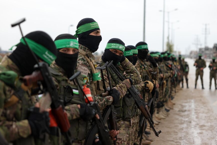 Palestinian Hamas fighters gathered at the site of the handover in a show of strength