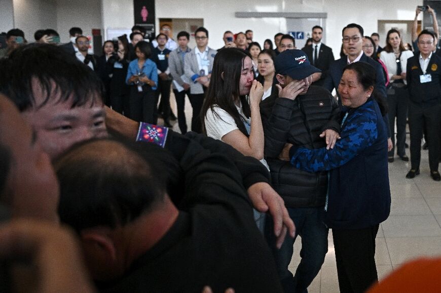Freed Thai nationals Sathian Suwannkham and Bannawat Saethao, held hostage in Gaza for more than a year, hug family members on their return to Thailand