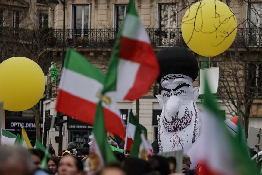 Protesters with an effigy of Iran's supreme leader Ayatollah Ali Khamenei 