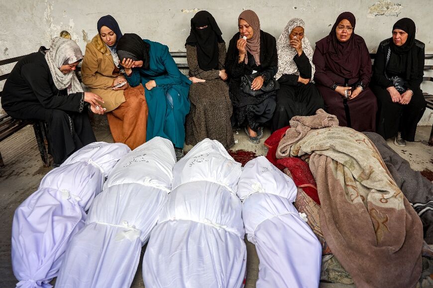 Tearful relatives gathered to mourn those killed in the Israeli strikes
