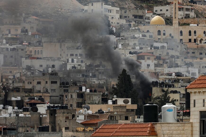 Smoke billows after an explosion over the Jenin camp for Palestinian refugees in the occupied West Bank during an Israeli raid on February 24, 2025