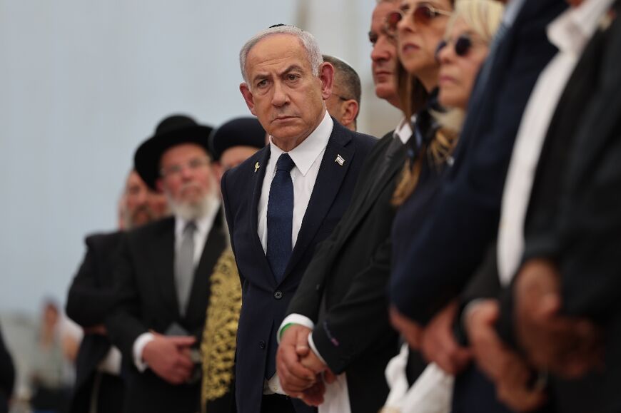 Israeli Prime Minister Benjamin Netanyahu (C), whose country has denied accusations of 'genocide' against Palestinians