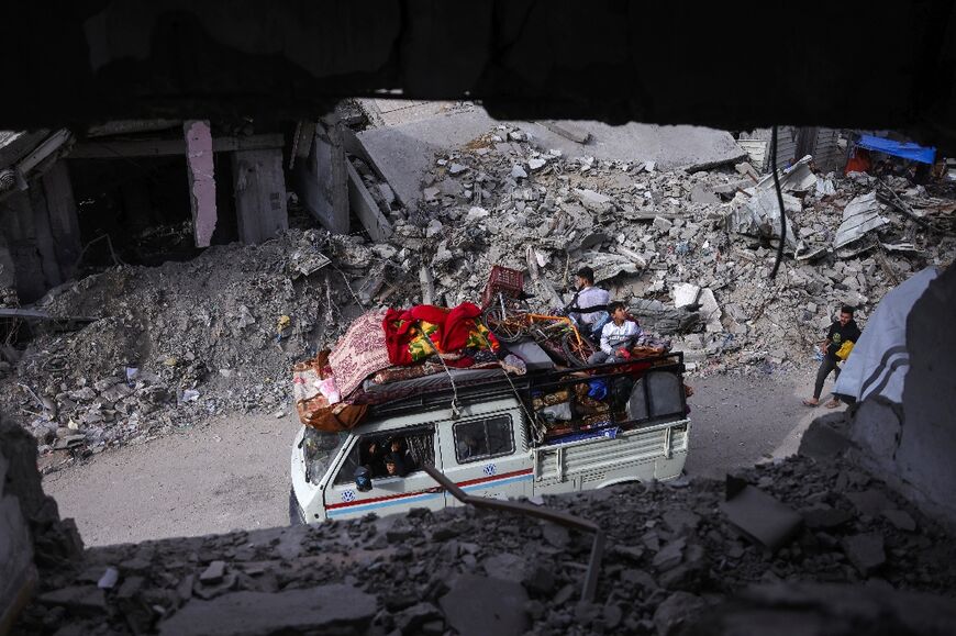 Palestinians arrive in Gaza City with their belongings after fleeing neighbourhoods east of the city following Israeli evacuation orders