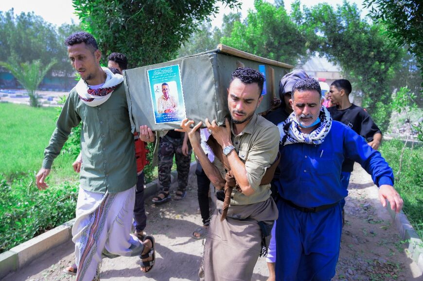 Yemenis attend the funeral of people killed in US strikes on the Ras Issa fuel terminal
