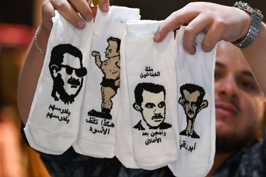 Socks bearing caricatures of the Assads on sale in Damascus