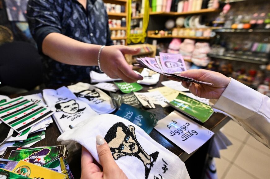 A customer hands over cash for Assad socks