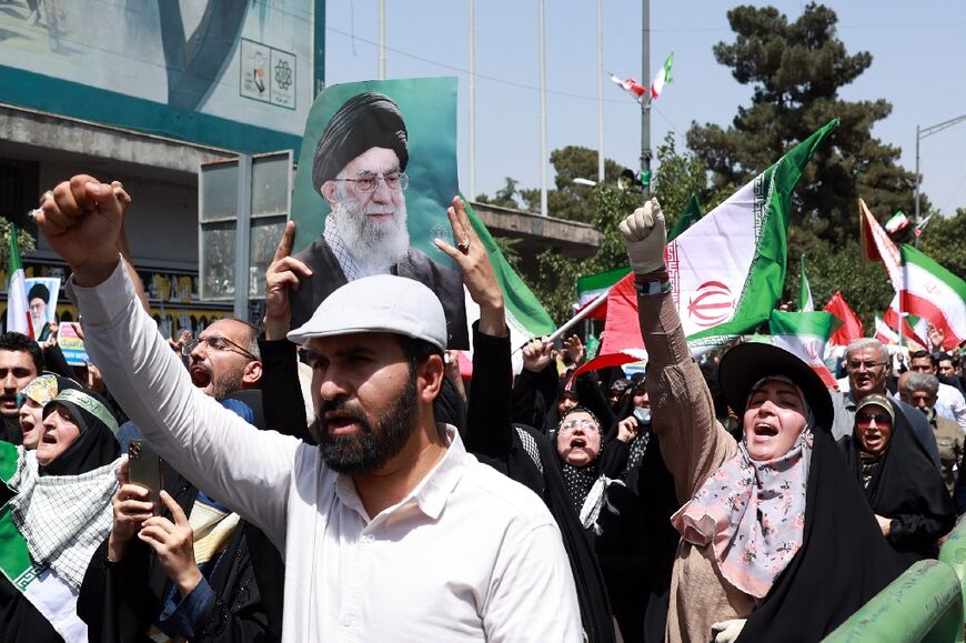 Iranians rally in support of their leaders, in Tehran
