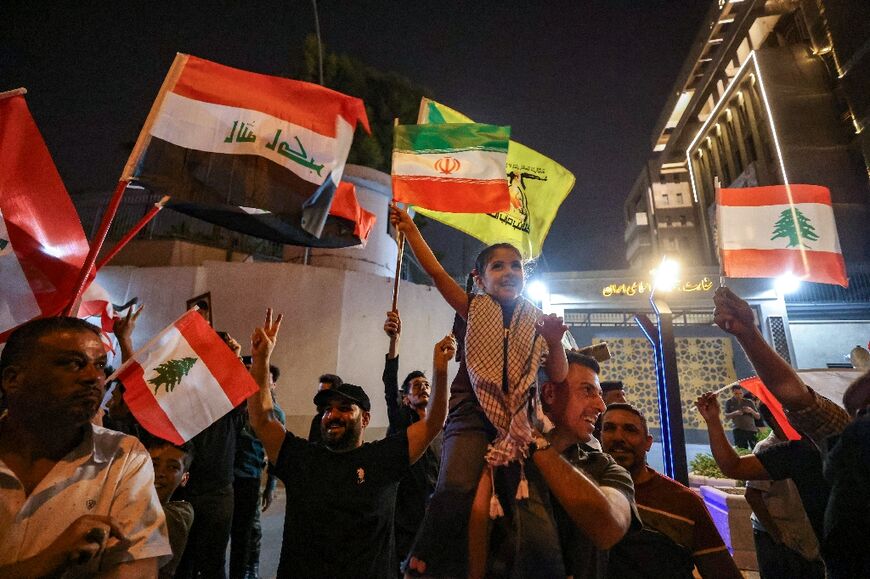 Iraqi supporters of Iran celebrated in Baghdad following the start of a truce 
