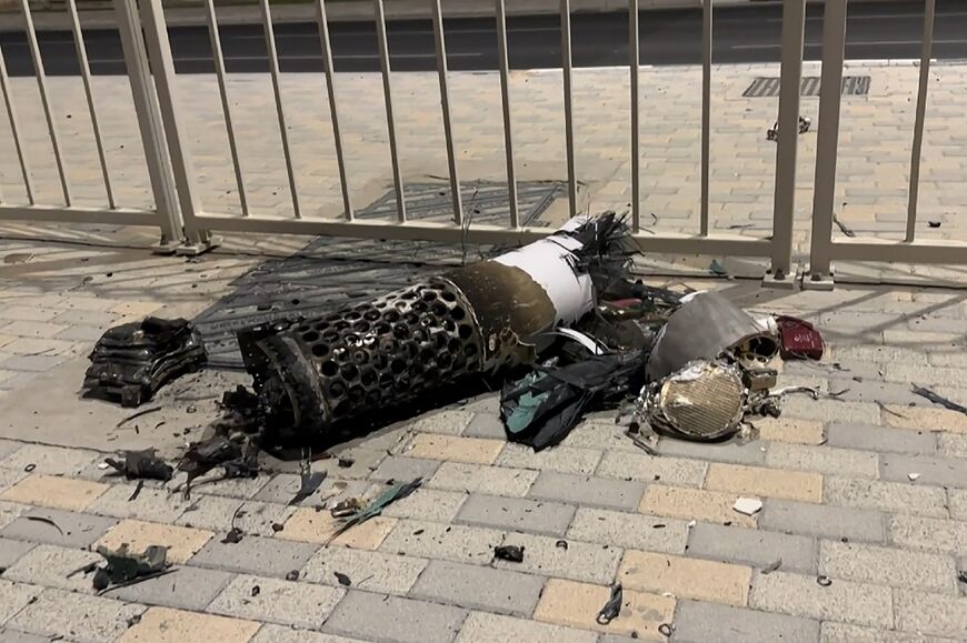 AFPTV footage shows the remnants of an Iranian missile intercepted over Qatar