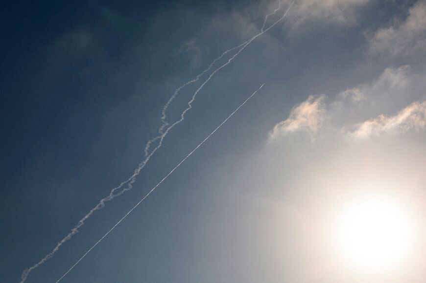 Rocket trails are seen in the sky above the Israeli coastal city of Netanya amid a fresh barrage of Iranian missile attacks 