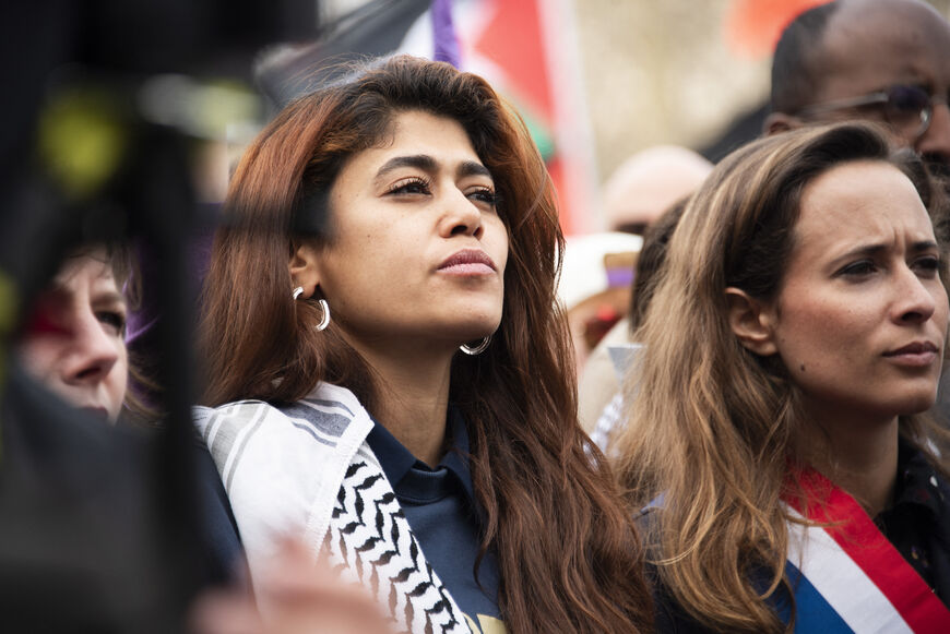 Rima Hassan (L), Clemence Guette (R) attend a demonstration in Paris on March 22, 2025, as part of the international day against racism and fascism. (Photo by Magali Cohen / Hans Lucas / Hans Lucas via AFP) 