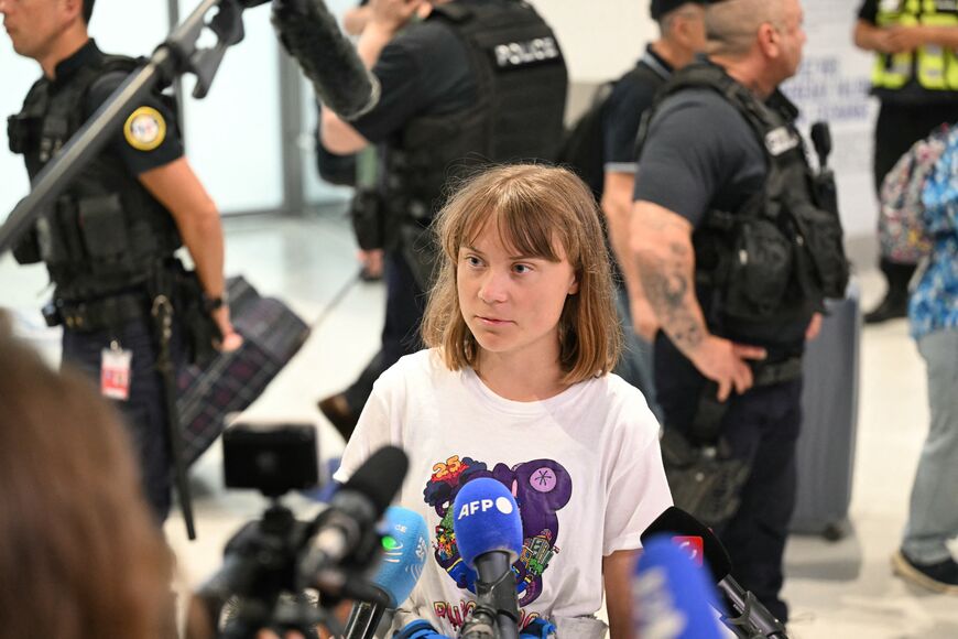 Swedish campaigner Greta Thunberg talks to journalists upon her arrival to Roissy-Charles de Gaulle Airport, as she left Israel on a flight to Sweden via France, after she was detained along with other activists aboard a Gaza-bound aid boat, on June 10, 2025. (Photo by HUGO MATHY/AFP via Getty Images)