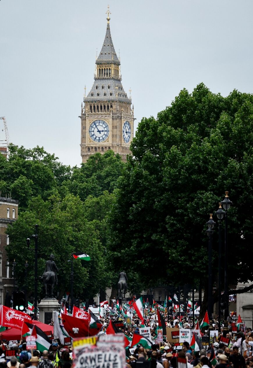 Protesters in London waved Palestinian flags and carried signs including 'Stop arming Israel' and 'No war on Iran'