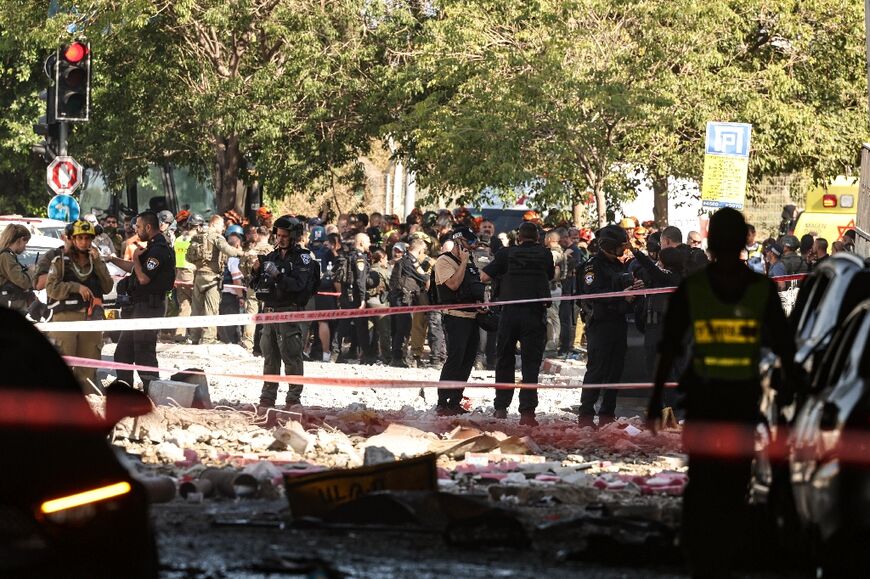 Israeli forces cordon off an area  in the coastal city of Haifa after Iranian missile fire