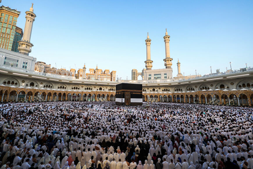 Muslims participate in a special morning prayer around the Kaaba, Islam's holiest shrine, at the Grand Mosque complex in Mecca on June 6, 2025, to mark the start of the Eid al-Adha festival, which marks the end of their Hajj pilgrimage. (Photo by AFP via Getty Images)