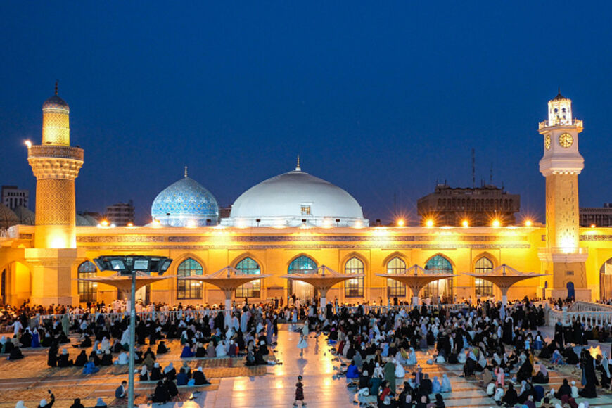 Muslims arrive to participate in a special morning prayer to mark the start of the Eid al-Adha festival at the shrine of 12th-century Sunni cleric Abdul Qadir al-Jilani in Baghdad on June 6, 2025. (Photo by MURTAJA LATEEF / AFP) (Photo by MURTAJA LATEEF/AFP via Getty Images)