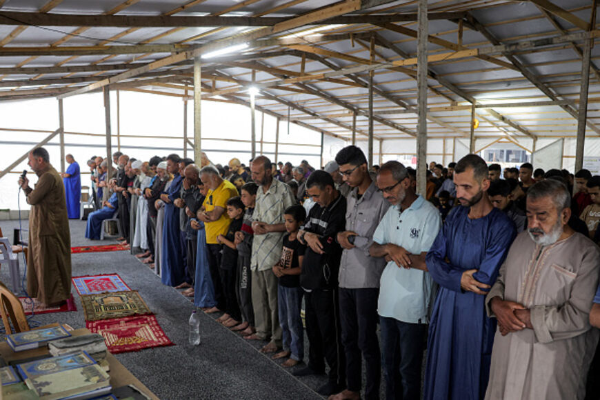 Muslim worshippers attend the early morning prayers for Eid al-Adha, the feast of sacrifice, in the make-shift prayer room of the Nour mosque in the Abu Amin neighbourhood in northeastern Gaza City on June 6, 2025. (Photo by Bashar TALEB / AFP) (Photo by BASHAR TALEB/AFP via Getty Images)