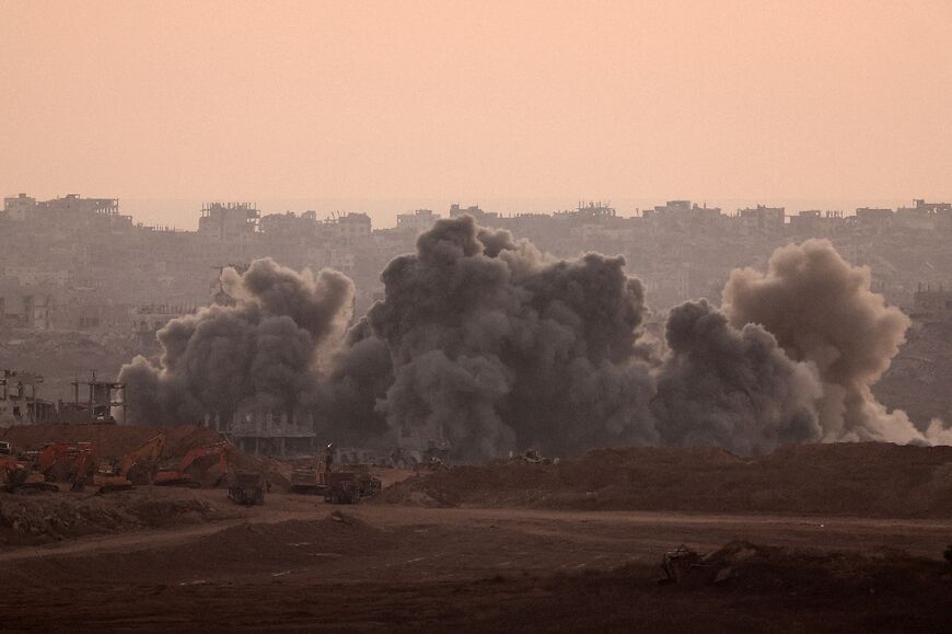 A picture taken from a position at Israel's border with the Gaza Strip shows smoke billowing during an Israeli strike on the besieged Palestinian territory on July 8, 2025