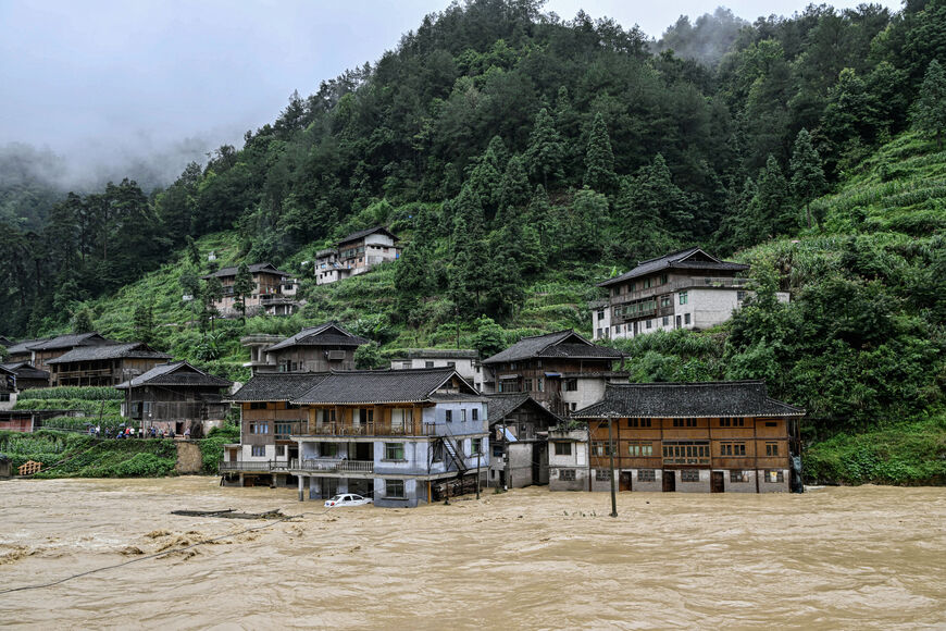 This photo shows submerged buildings at a flood-affected village in Kaili, in southwestern China's Guizhou province on June 28, 2025. (Photo by AFP) / China OUT (Photo by STR/AFP via Getty Images)