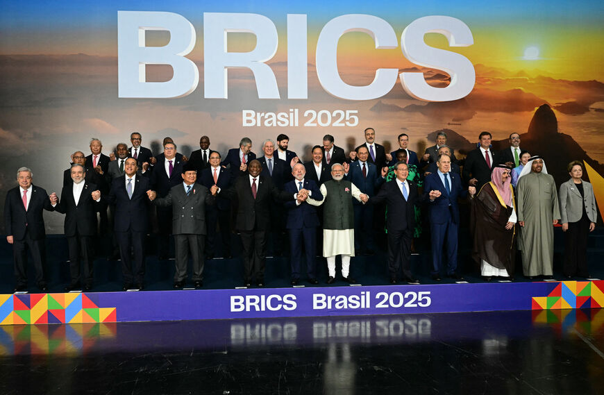 Heads of state and government of member, partner, and external engagement countries pose for a family photo during the BRICS summit in Rio de Janeiro, Brazil, on July 7, 2025. BRICS leaders at a summit on Sunday took aim at US President Donald Trump's "indiscriminate" import tariffs and recent Israeli-US strikes on Iran. (Photo by Pablo PORCIUNCULA / AFP) (Photo by PABLO PORCIUNCULA/AFP via Getty Images)