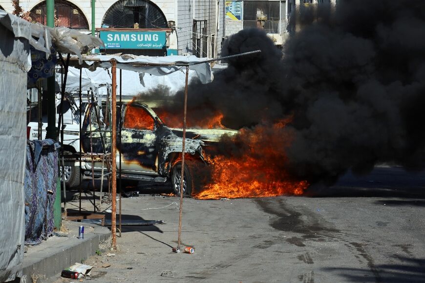 The streets of Sweida were dotted with corpses, burned-out cars and damaged storefronts on Thursday