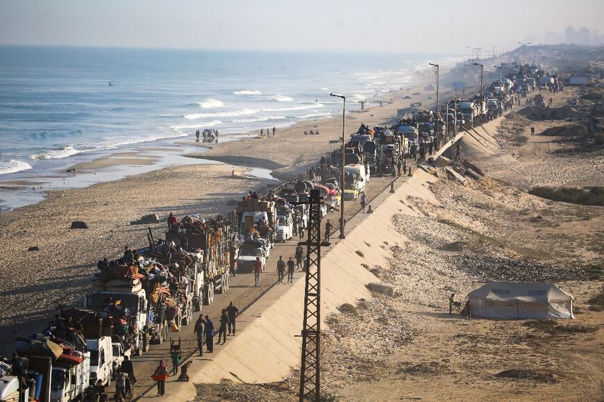 Palestinians stream out of Gaza City in what a top UN official calls "new waves of mass displacement".