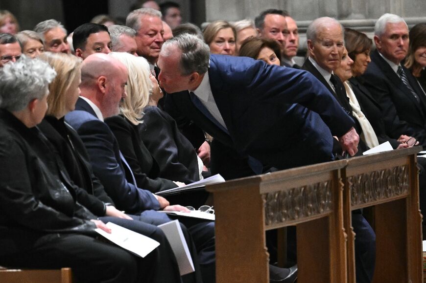 Former US President George W. Bush greets Lynne Cheney, the wife of the late US Vice President Dick Cheney, during his funeral service at the Washington National Cathedral in Washington, DC, on November 20, 2025