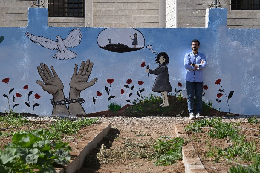 Bilal Shorba has painted a mural on one of the cemetery walls