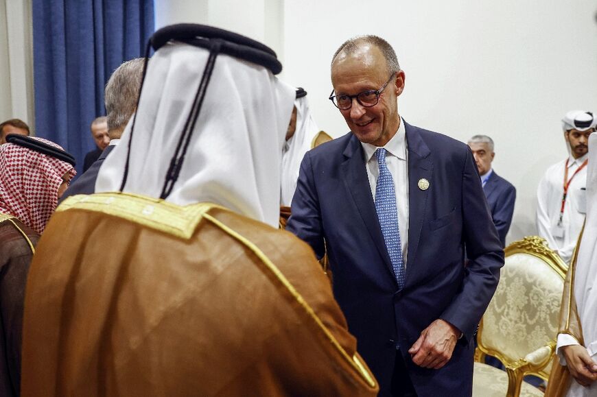 German Chancellor Friedrich Merz meets Qatar's Amir Sheikh Tamim bin Hamad al-Thani in Egypt on October 13, 2025